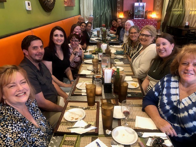 teachers around a table eating dinner