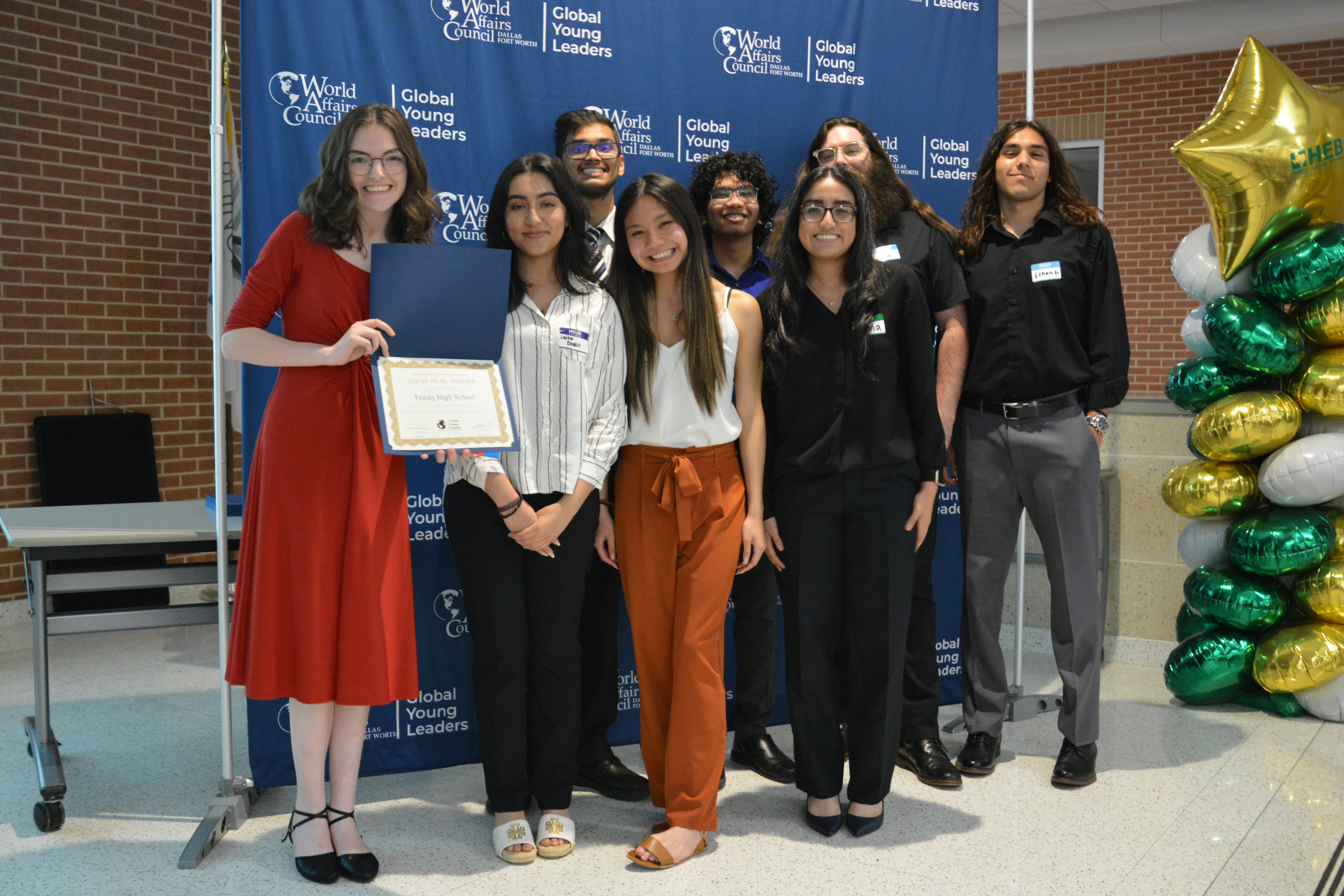 Trinity High School students holding their certificate for winning Top 10 JWAC in 2023