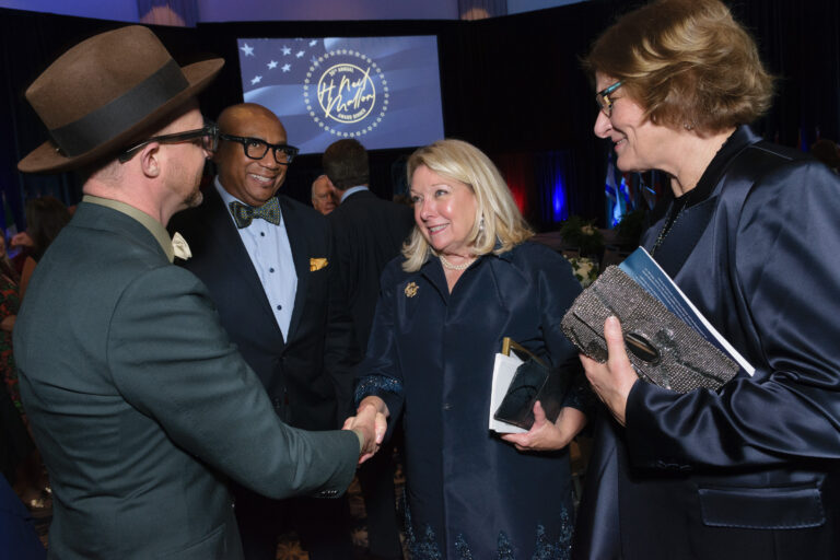 Mallon Award Dinner - Attendees greet Honoree Amb. Jeanne L. Phillips and moderator Karen Hughes
