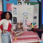 Thumbnail of http://A%20student%20stands%20beside%20a%20presentation%20posterboard.